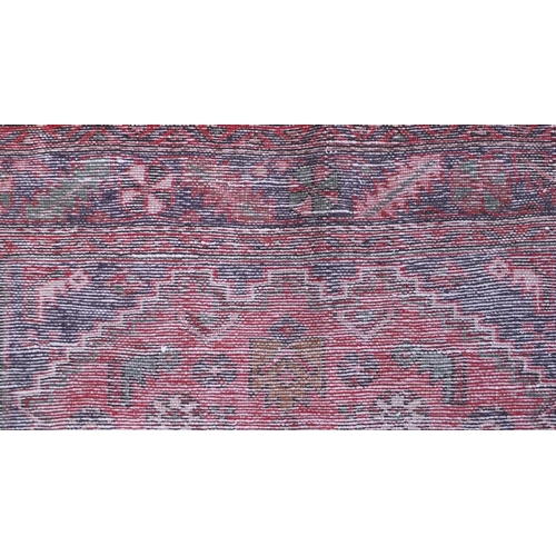 2089 - Rectangular Hamadan rug with an all over stylised geometric pattern within three borders onto a pred... 