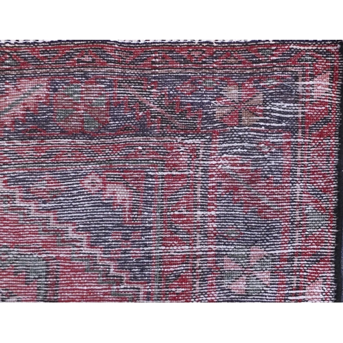 2089 - Rectangular Hamadan rug with an all over stylised geometric pattern within three borders onto a pred... 