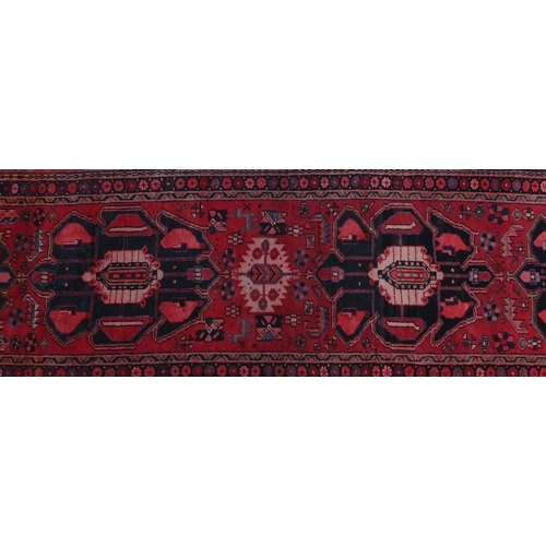 2086 - Rectangular Azerbaijan carpet runner with an all over geometric floral design within a floral border... 