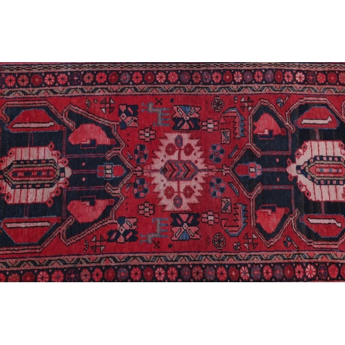 2086 - Rectangular Azerbaijan carpet runner with an all over geometric floral design within a floral border... 