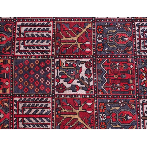 2061 - Rectangular Bakhtiari rug with an all over floral and geometric tile pattern within a floral border,... 