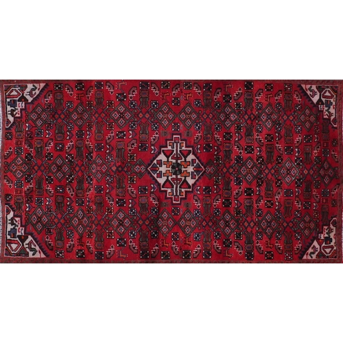 2083 - Rectangular Hamadan rug with an all over floral and animal decoration, 220cm x 133cm