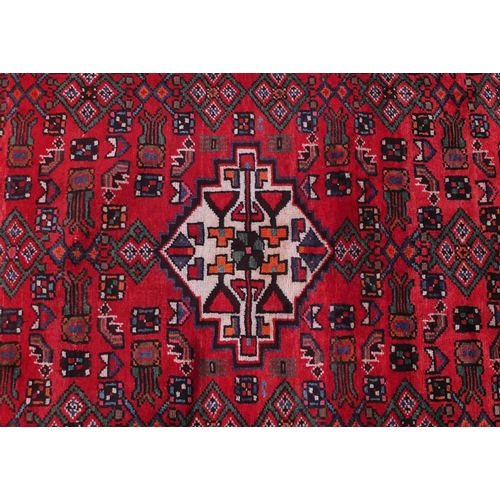 2083 - Rectangular Hamadan rug with an all over floral and animal decoration, 220cm x 133cm