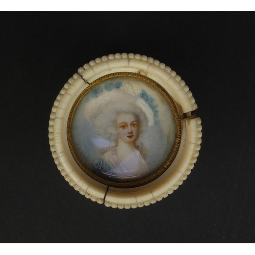 2388 - 19th century ivory pot and cover, the lid hand painted with a lady wearing a white dress and bonnet,... 