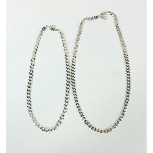 2610 - Two silver curb link necklaces, the larger 50cm long, approximate weight 63.0g