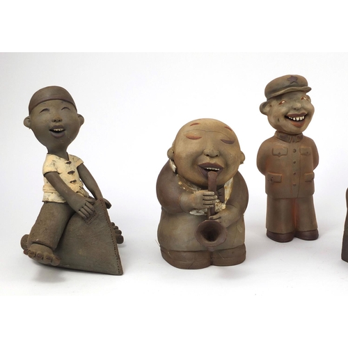 2316 - Six comical Chinese terracotta figure three in uniform, two riding a pillows and one playing an musi... 