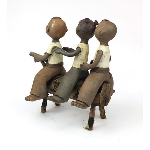 2360 - Comical Chinese terracotta figure group of three children seated on a branch, 37cm high