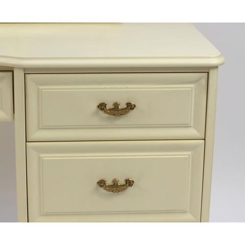 11 - Modern cream bedroom suite comprising pair of four drawer chests, dressing table with triple aspect ... 