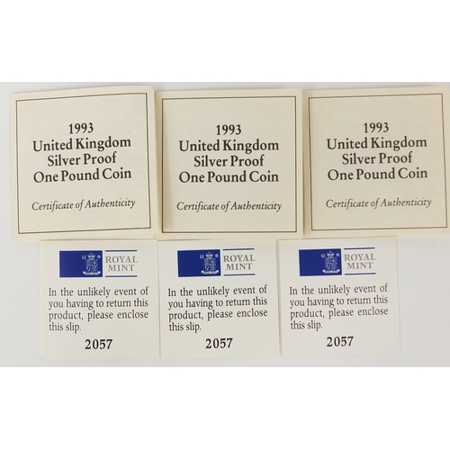 2736 - Three 1993 United Kingdom silver proof £1 coins, each with fitted cases and certificates