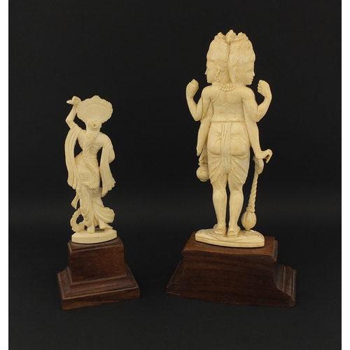 614 - Two Indian carved ivory figures, each raised on hard wood bases, the largest overall 20cm hig