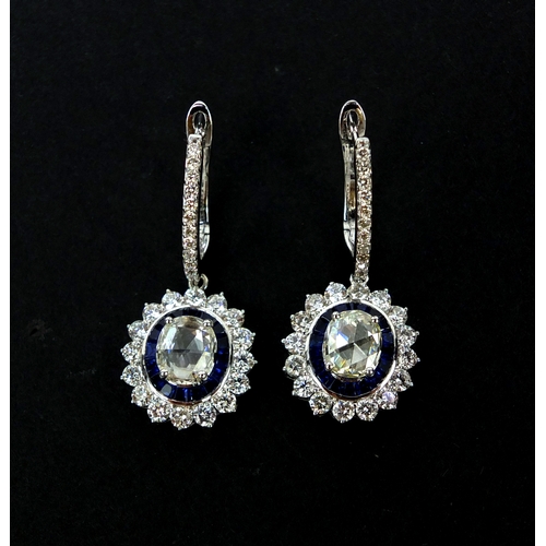 911 - Pair of 18ct white gold oval diamond and sapphire drop earrings, 3.5cm long, approximate weight 8.2g