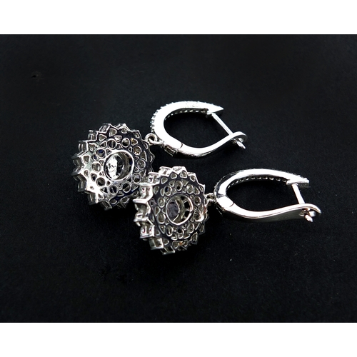 911 - Pair of 18ct white gold oval diamond and sapphire drop earrings, 3.5cm long, approximate weight 8.2g