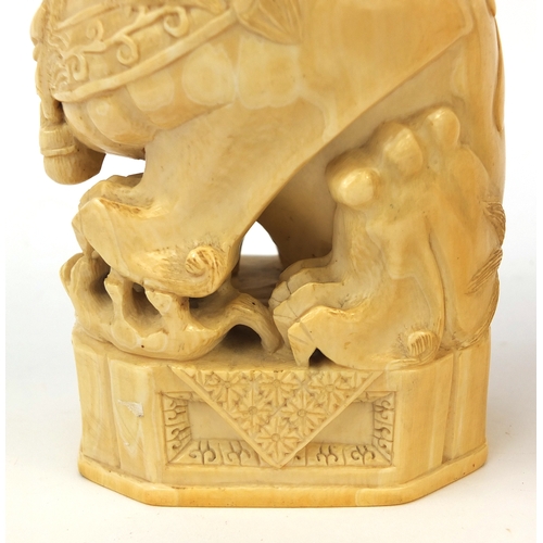 527 - Pair of well detailed Chinese carved ivory foo dogs, raised on hardwood bases, character marks to th... 