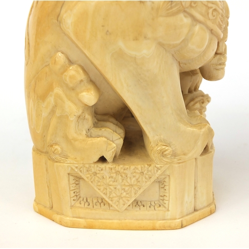 527 - Pair of well detailed Chinese carved ivory foo dogs, raised on hardwood bases, character marks to th... 