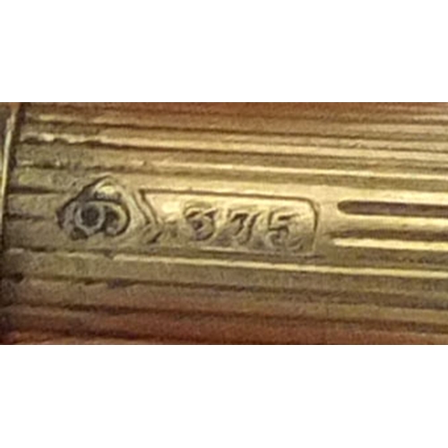 121 - S Mordan & Co 9ct gold propelling pencil retailed by Apsrey, with engine turned decoration and bank ... 