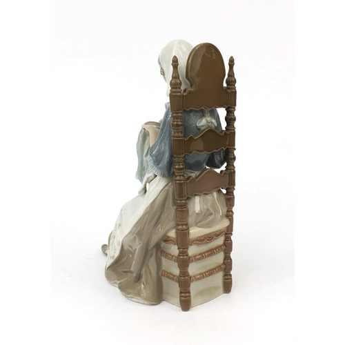 2126 - Lladro figure of a seated female knitting, factory marks and numbered 16 to the base, 29cm high