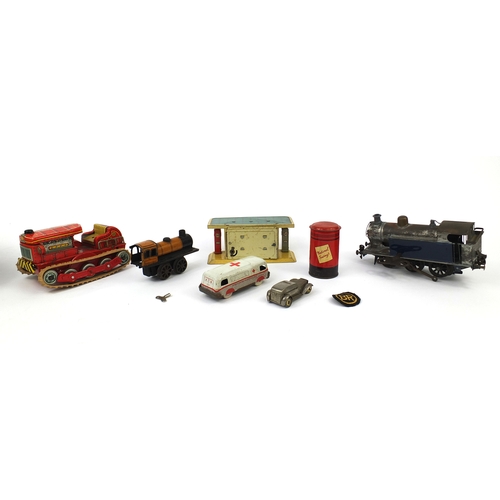 419 - Group of tinplate and clockwork toys including an orange Schuco locomotive, blue locomotive marked '... 