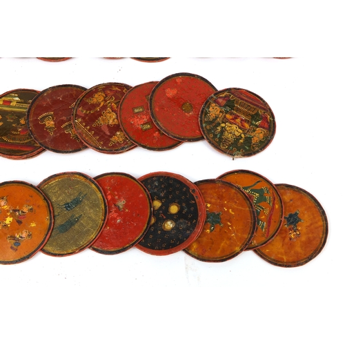 617A - Rectangular Indian box housing a collection of circular lacquered gaming tokens, each hand painted w... 