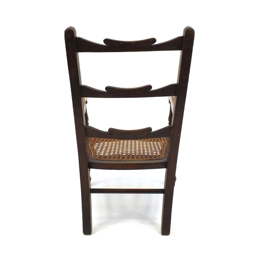 96 - Childs beech ladder back chair with cane seat, 66cm high