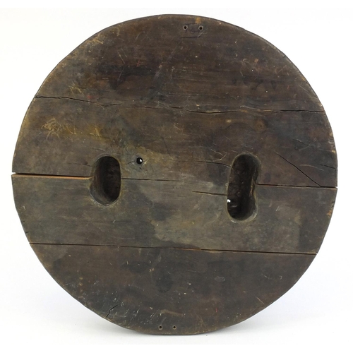 381 - Circular carved oak wood block of a gorillas head, 31.5cm in diameter