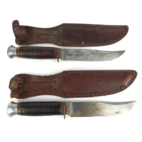 658 - Two Fagan hunting knifes with leather sheaths, 23cm long