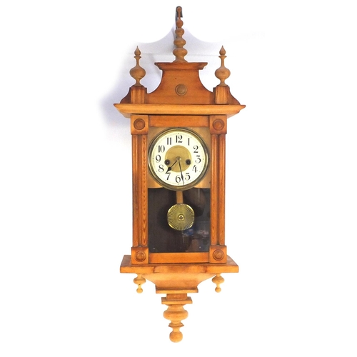 118 - Pine wall hanging striking clock, 75cm long