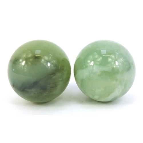 380 - Pair of polished jadeite balls, approximately 5cm in diameter