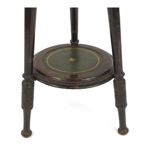 50 - Circular mahogany dish top occasional table with under tier and tooled leather insert, 70cm high x 3... 