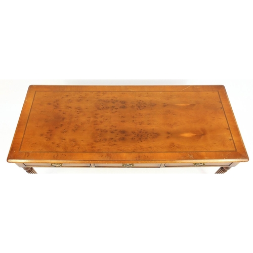 14 - Rectangular inlaid yew coffee table fitted with three drawers, 46cm high x 121cm wide x 50cm deep