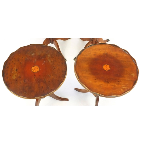 24 - Pair of shaped yew occasional tables with tooled leather tops and two inlaid mahogany tripod occasio... 
