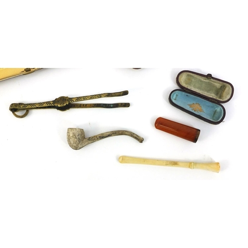 368 - Smoking items including an amber cheroot, clay pipe, set of brass ember tweezers, leather cigarette ... 