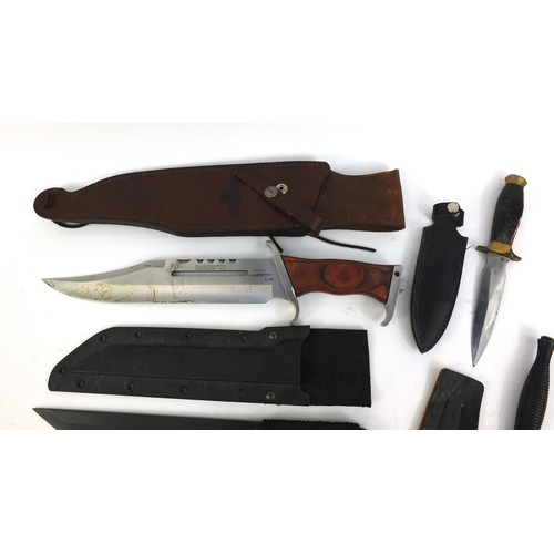 666 - Four hunting knives in sheaths and a Rambo 3 Hibben knife