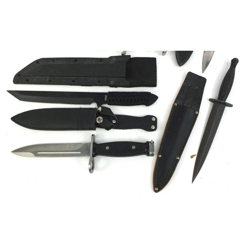 666 - Four hunting knives in sheaths and a Rambo 3 Hibben knife