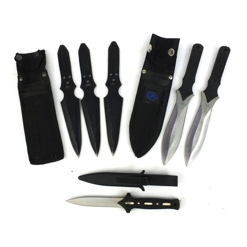 663 - Two sets of throwing knives and a knife with sheaf