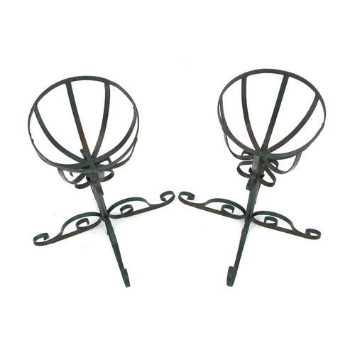 76 - Pair of wrought iron green painted planters, 62cm high