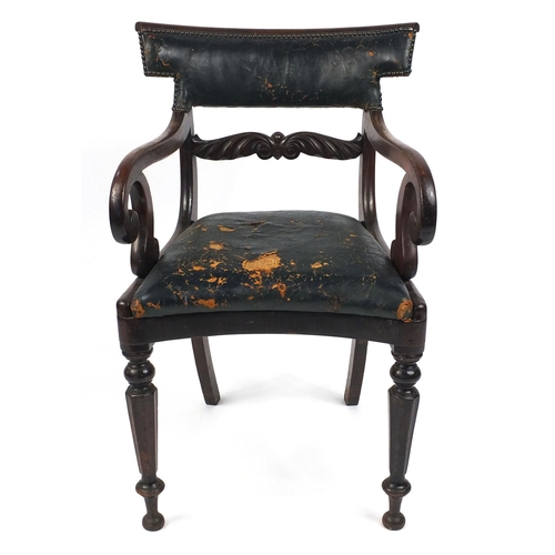 81 - Regency mahogany elbow chair with scroll arms and green leather upholstery