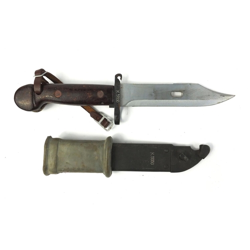 659 - Military interest bayonet and scabbard engraved K556, 33cm in length