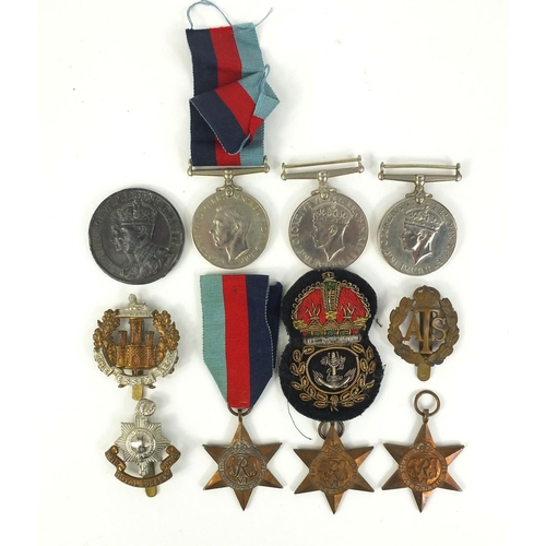 640 - Six  Military interest World War II medals, and a selection of badges