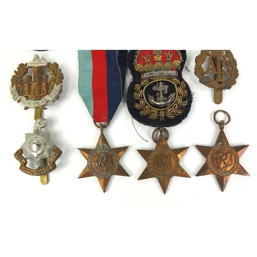 640 - Six  Military interest World War II medals, and a selection of badges