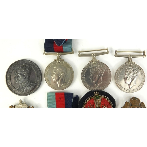 640 - Six  Military interest World War II medals, and a selection of badges