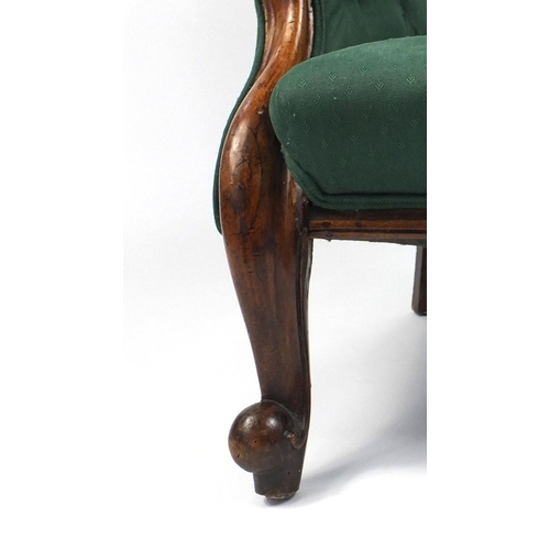3 - Victorian walnut framed armchair with green button back upholstery, 100cm high