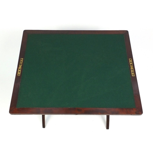 7 - Folding mahogany campaign card table with beize lined top, 53cm high