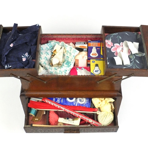 54 - 1930s oak cantilever sewing box and contents