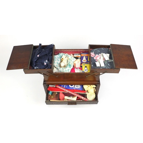 54 - 1930s oak cantilever sewing box and contents