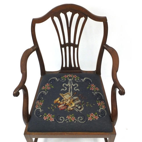 22 - Georgian mahogany elbow chair with musical instrument needlepoint upholstered seat, 94cm high