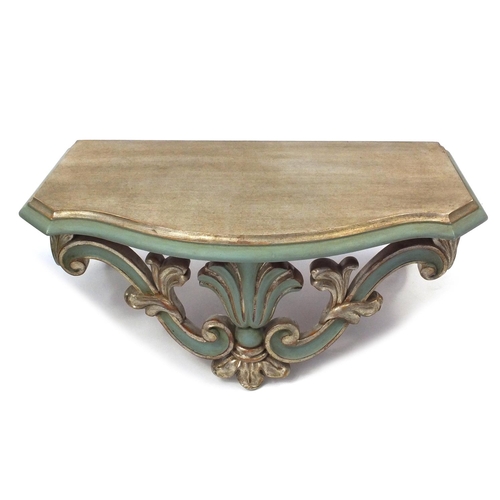 82 - Green painted and floral barrel and a green and gilt wall mounted shelf bracket