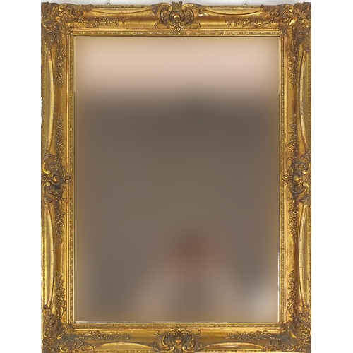 36 - Large peach glass wall hanging mirror with bevelled plate and ornate gilt frame, 100cm x 72cm