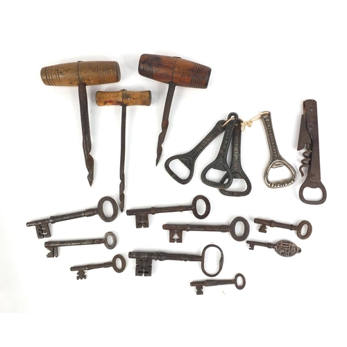 374 - Collection of antique corkscrews, bottle openers and keys