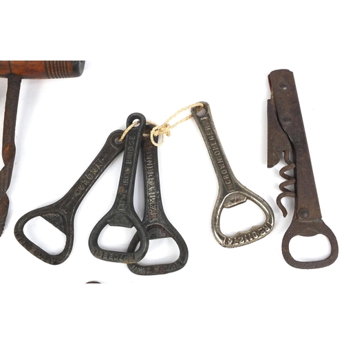 374 - Collection of antique corkscrews, bottle openers and keys