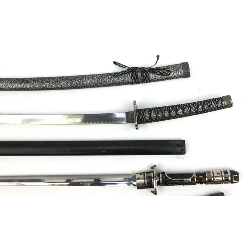 668 - Three decorative Samurai swords, the longest 120cm long